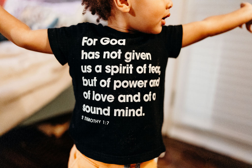 A child in a 2 Timothy 1:7 shirt